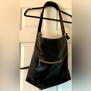 Black faux Leather Zip Top bag that turns into a backpack.